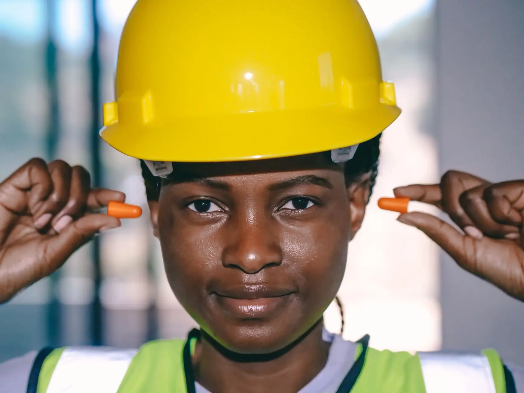 Engineer in a hard hat and hearing protection