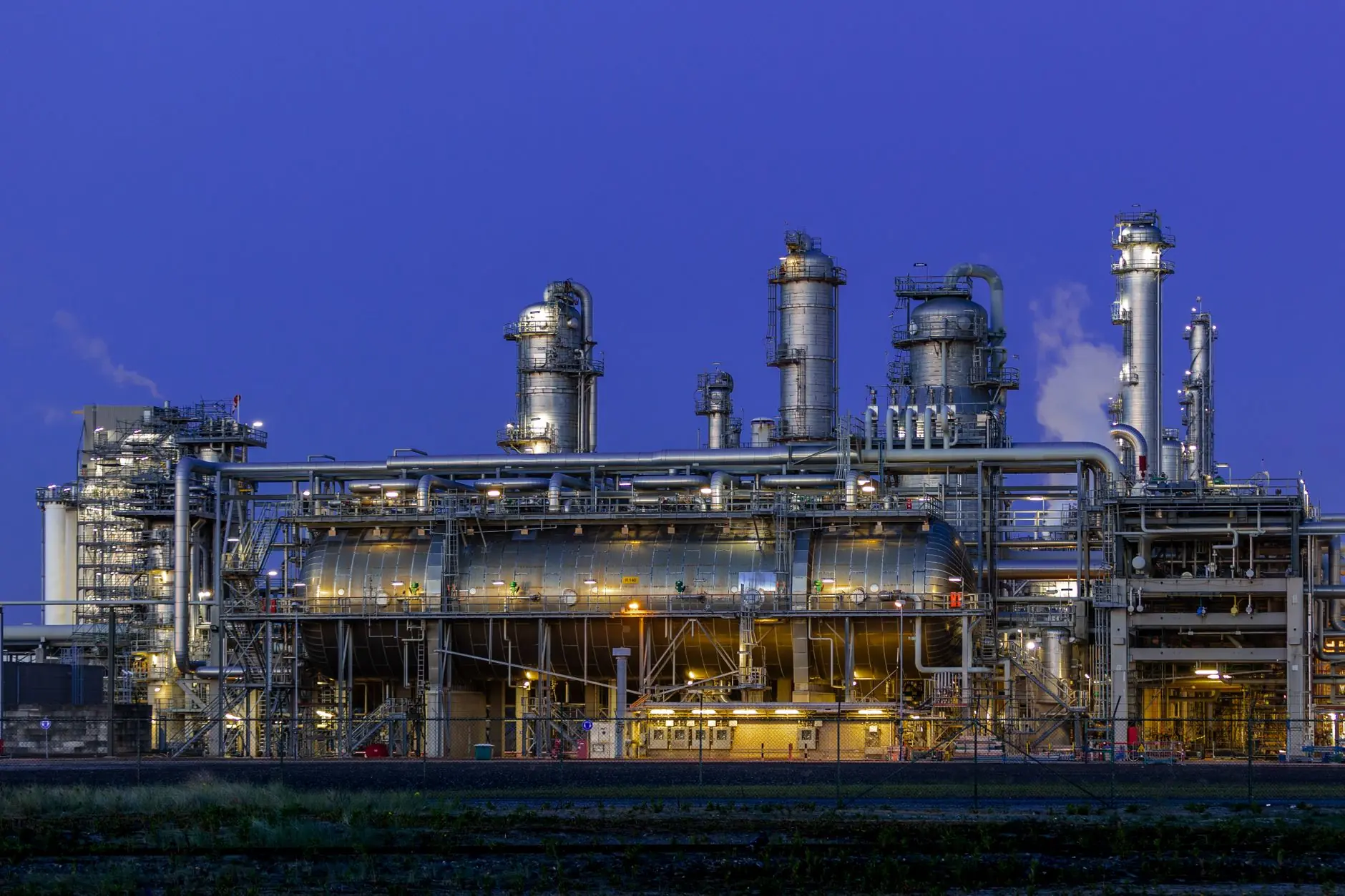 Refinery lit at dusk