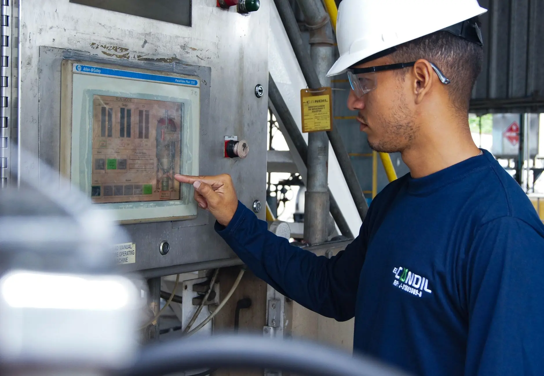 Engineer checking a control panel display