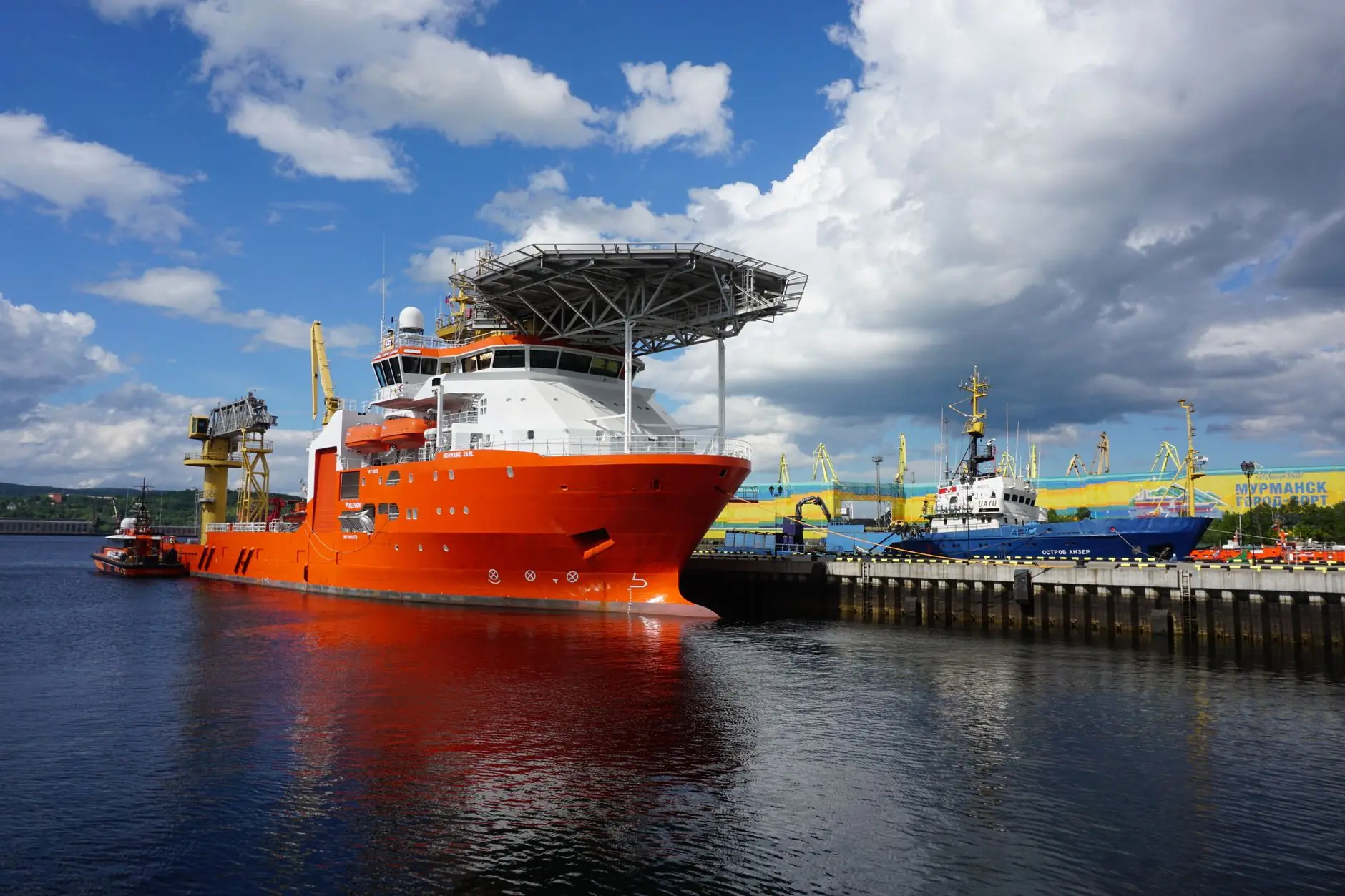 Offshore vessel moored at a port
